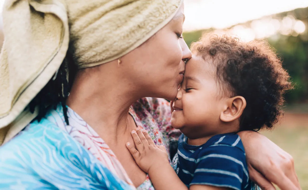 Mom Kissing toddler