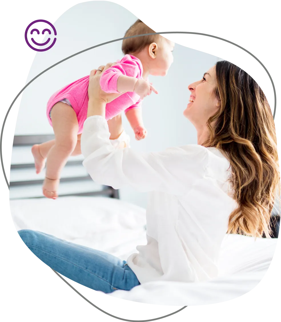 Mom lifting baby in the air